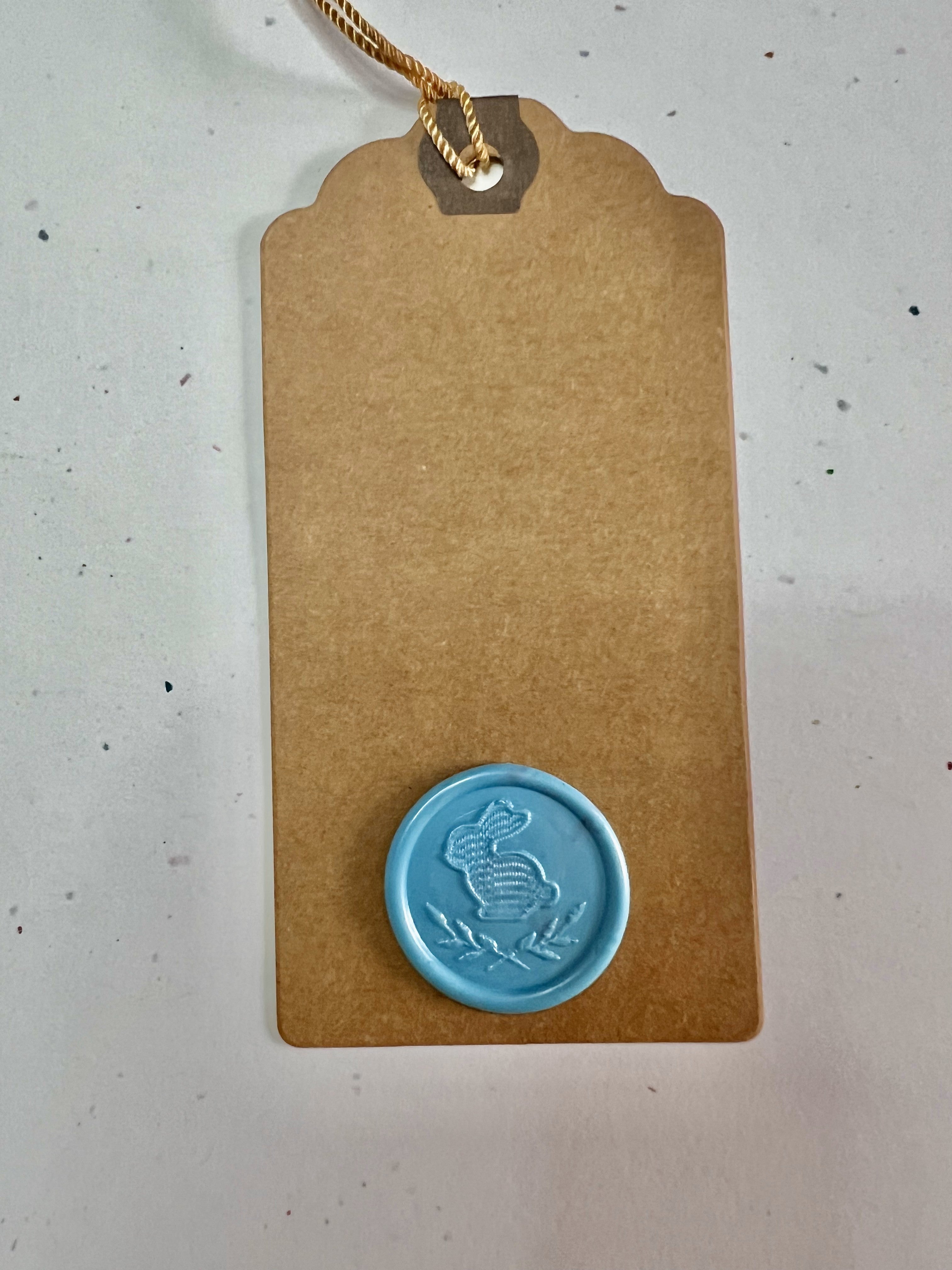 Elegant springtime gift tags with botanical wax seals, adding charm to seasonal celebrations.