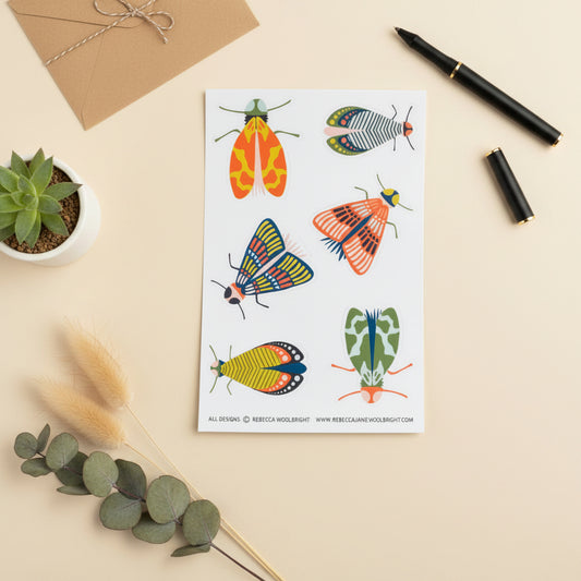 Sheet of colorful butterfly illustrations on a beige background