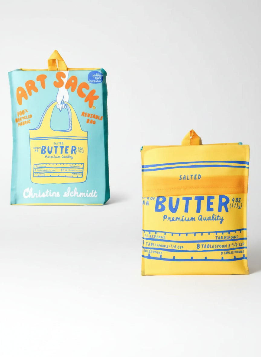 Two butter packages, one blue and one yellow, with 'Art Sack' branding on a white background.