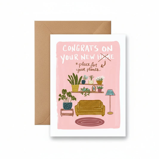 Greeting card with a pink background and illustrations of a living room with plants, accompanied by a brown envelope.