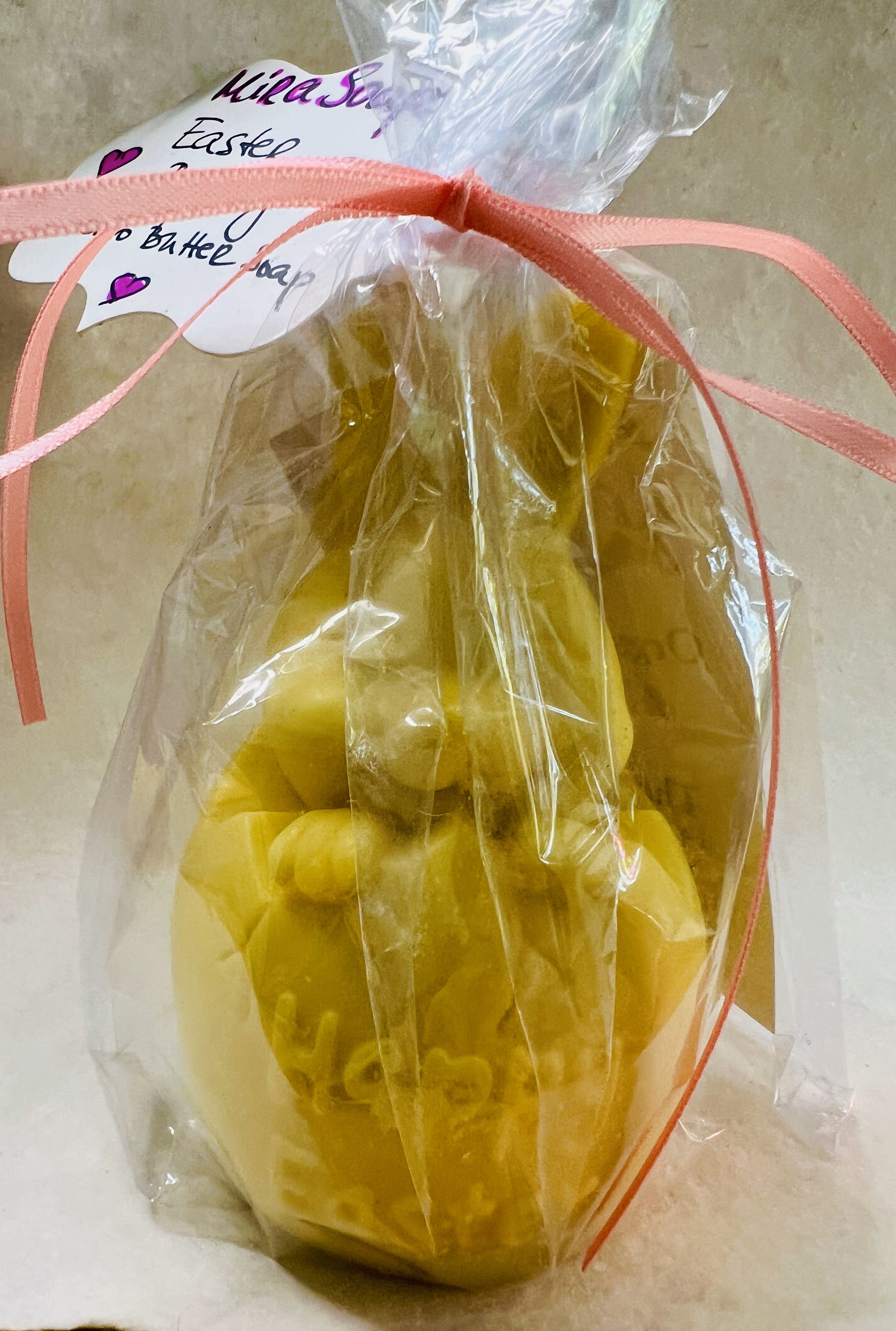 Close-up of detailed bunny soap with pastel Easter decor