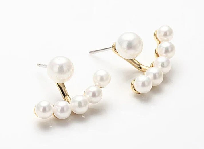 Handmade pearl earrings with gold-tone huggie design