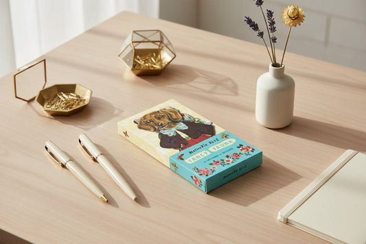 Notebook cover with a dog illustration and 'Nathalie Déte Fancy Fauna' text on a yellow and blue background