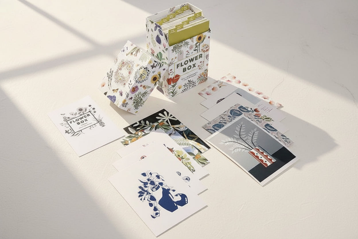 Set of floral and nature-themed greeting cards with a decorative box on a white background