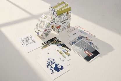 Set of floral and nature-themed greeting cards with a decorative box on a white background