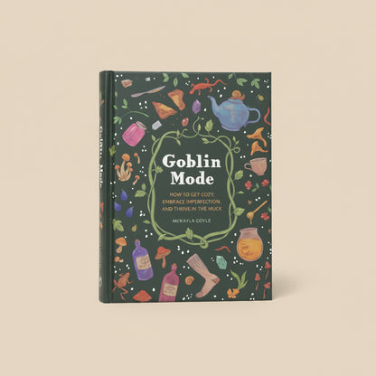 Book titled 'Goblin Mode' with colorful illustrations on a dark green background
