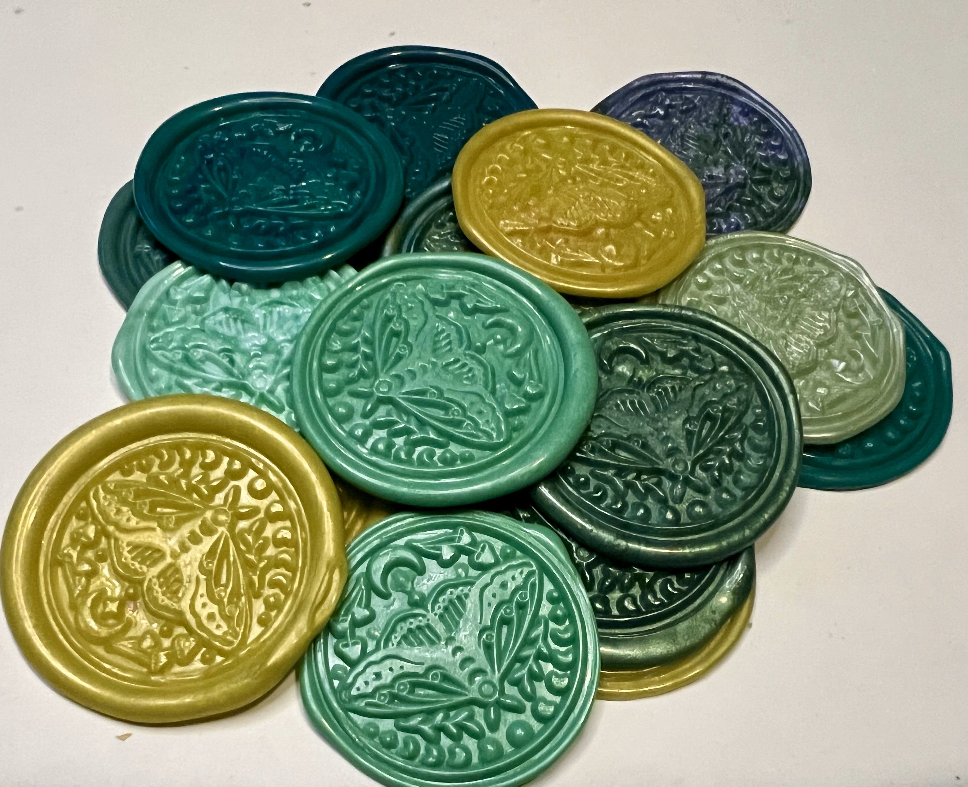 Green lunar moth wax seal sticker capturing earthy tones and mystical forest energy