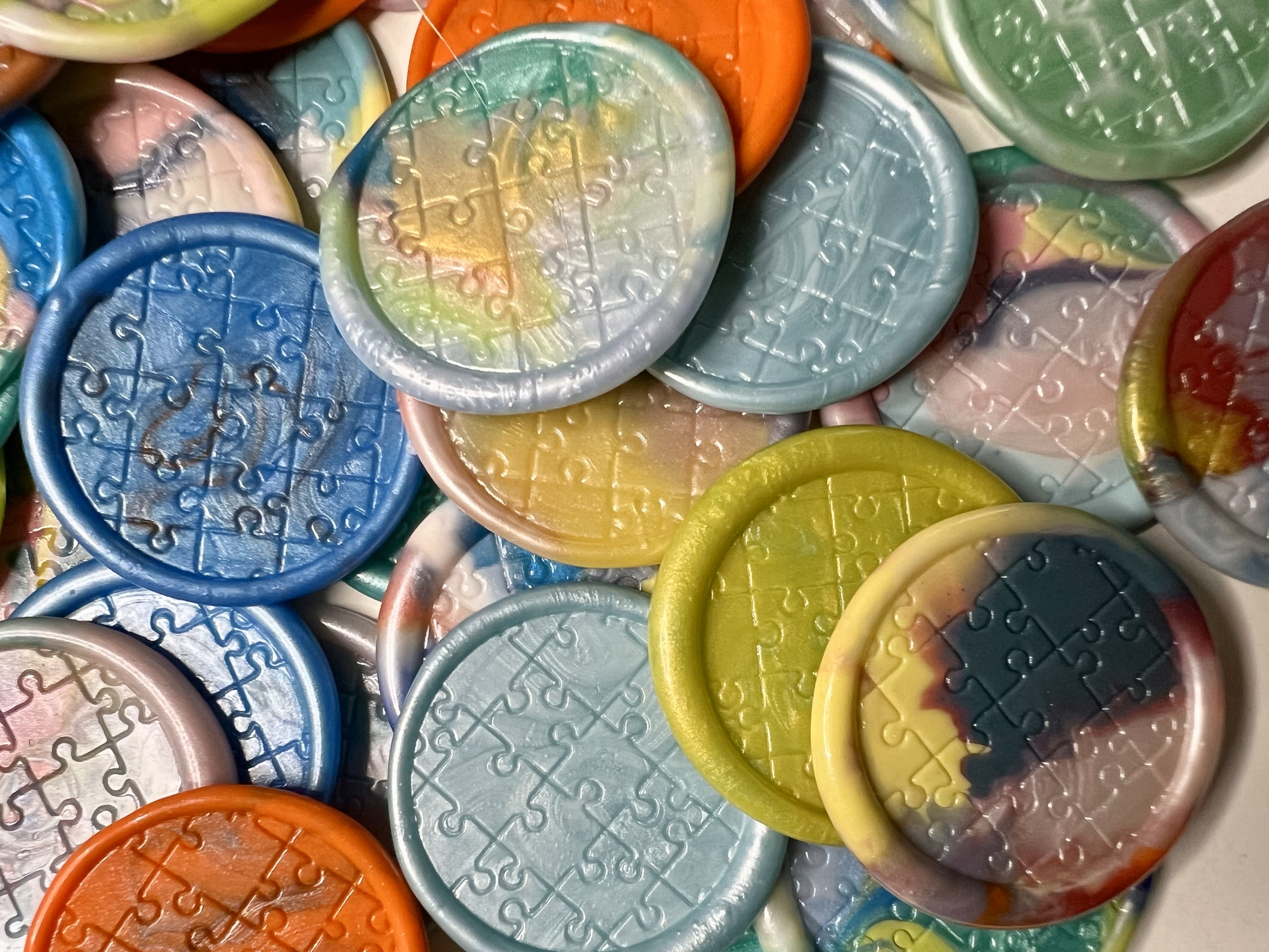 Close up view of the Autism Awareness wax seal stickers - each bag is a mystery as to which wax seal stickers you will receive!