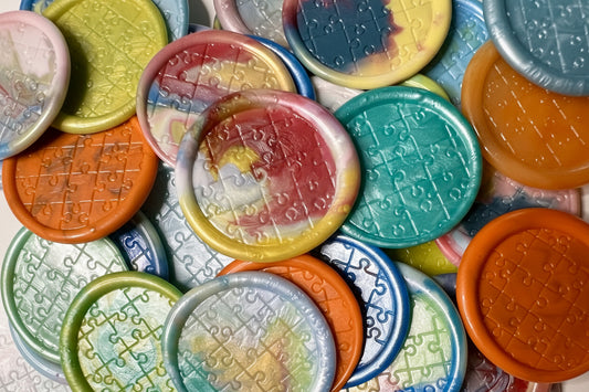 No two seals are a like in this pack of Autism Awareness wax seal stickers