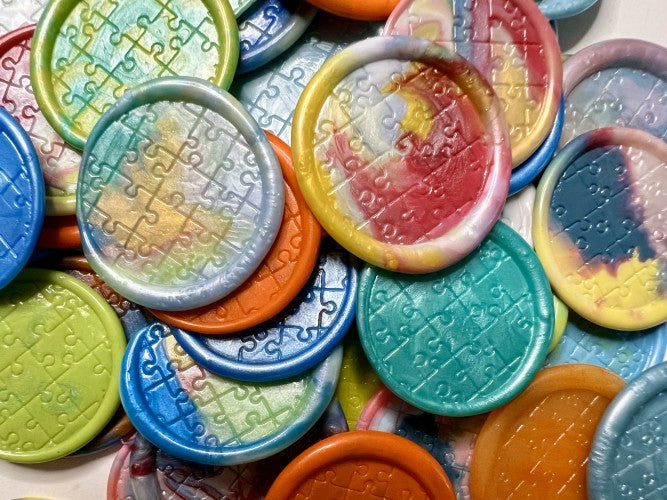 Combination of wax colors sealed with a puzzle stamp
