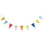 Long colorful fabric banner strung across white wall