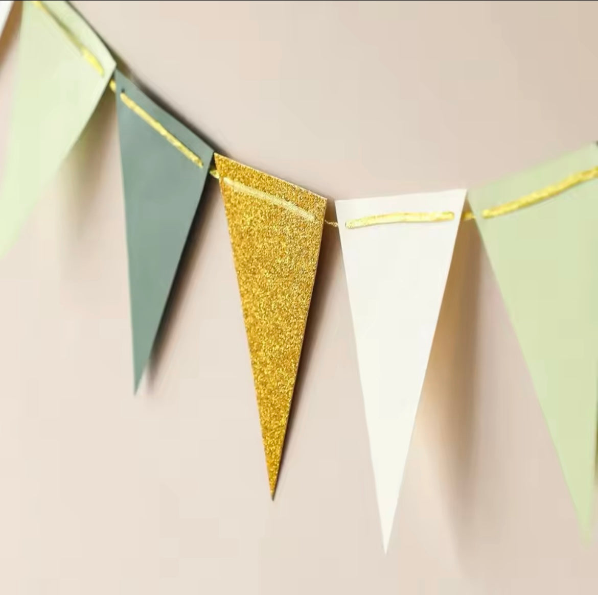 Close-up of triangle flags showing matte, glitter, and neutral textures