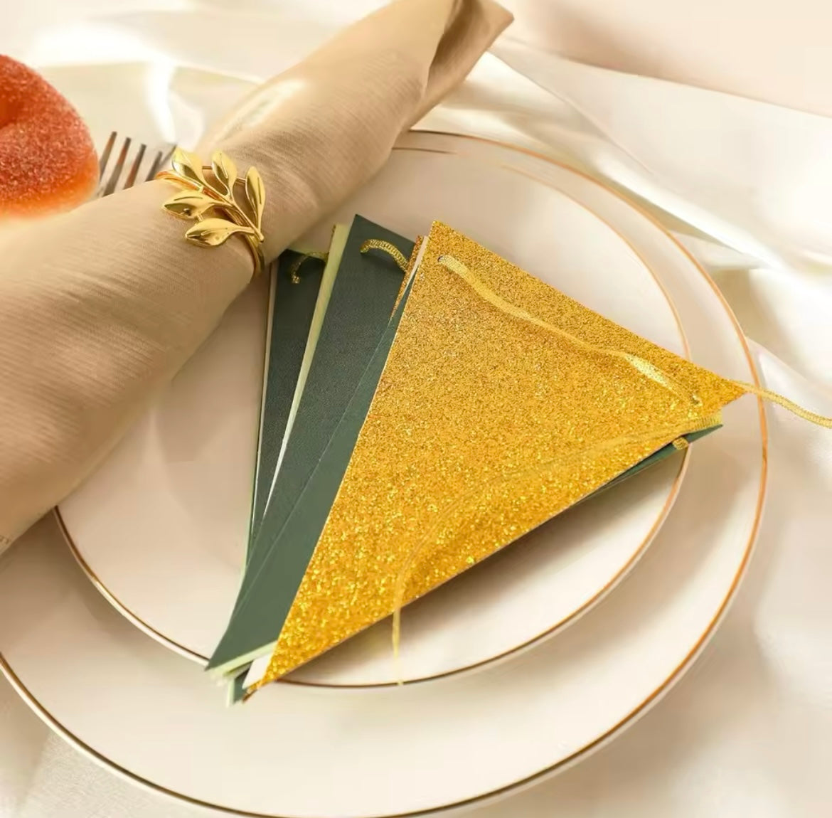 Close of view of the Glittery Gold paper on the triangle banner