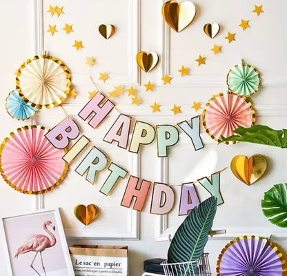Garland displayed with pastel balloons and rainbow decor