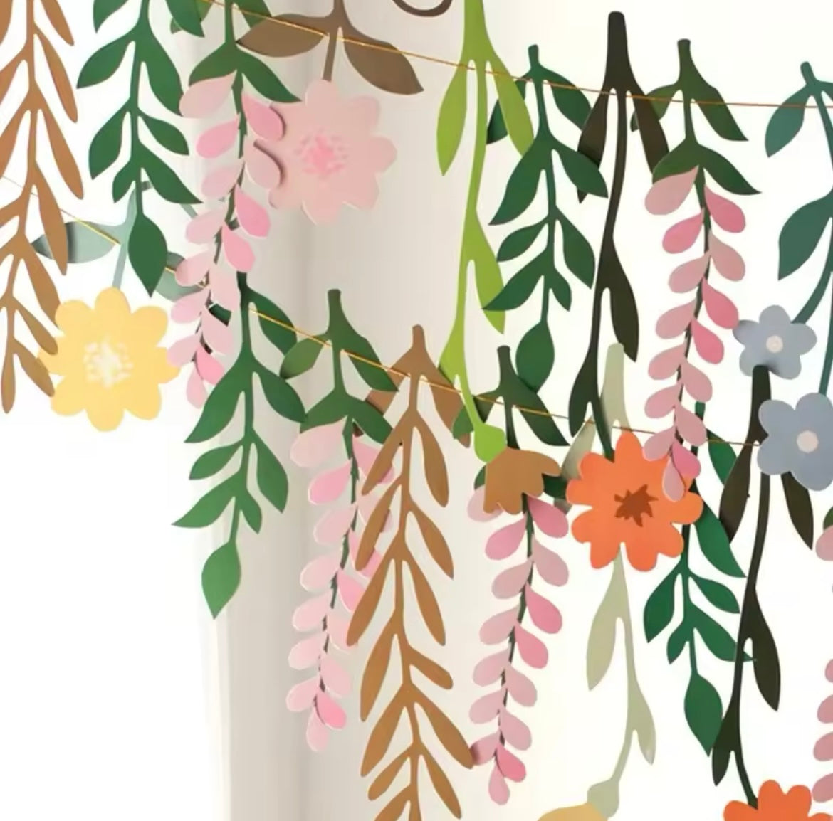 Close-up of paper flower and leaf details in vibrant spring colors