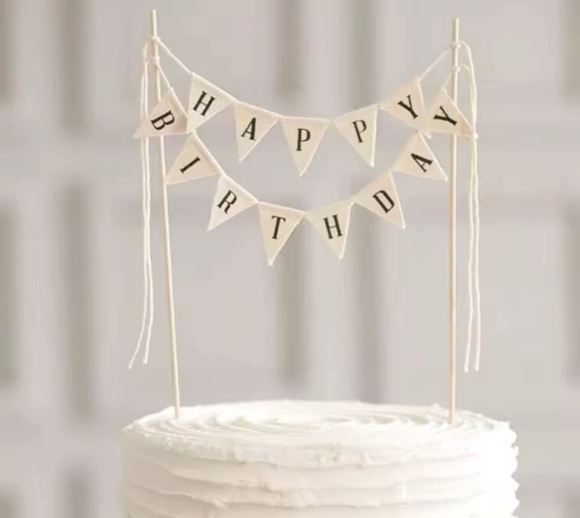 Neutral cream and black canvas flag in a birthday cake