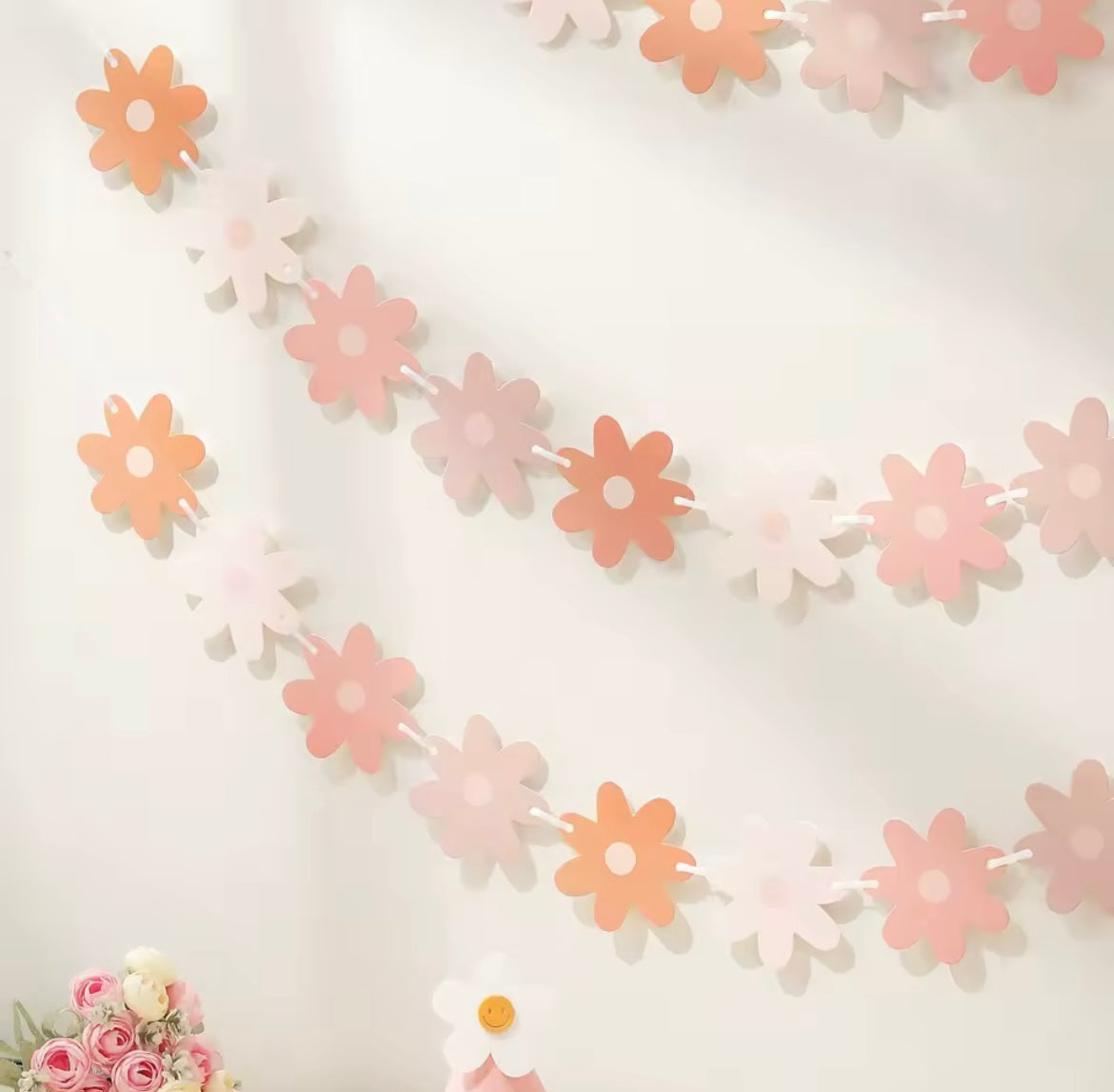 Floral garland above a spring-themed party table