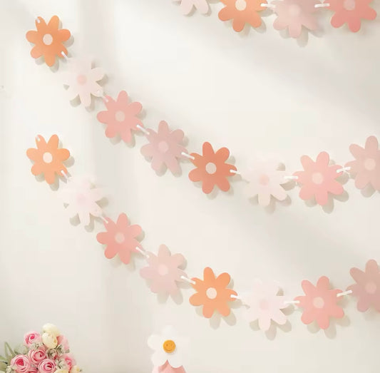 Floral garland above a spring-themed party table