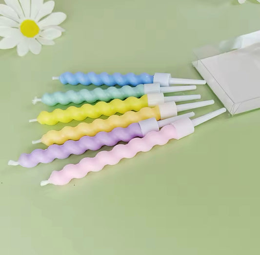 Six pastel swirl birthday candles with gradient ombré colors