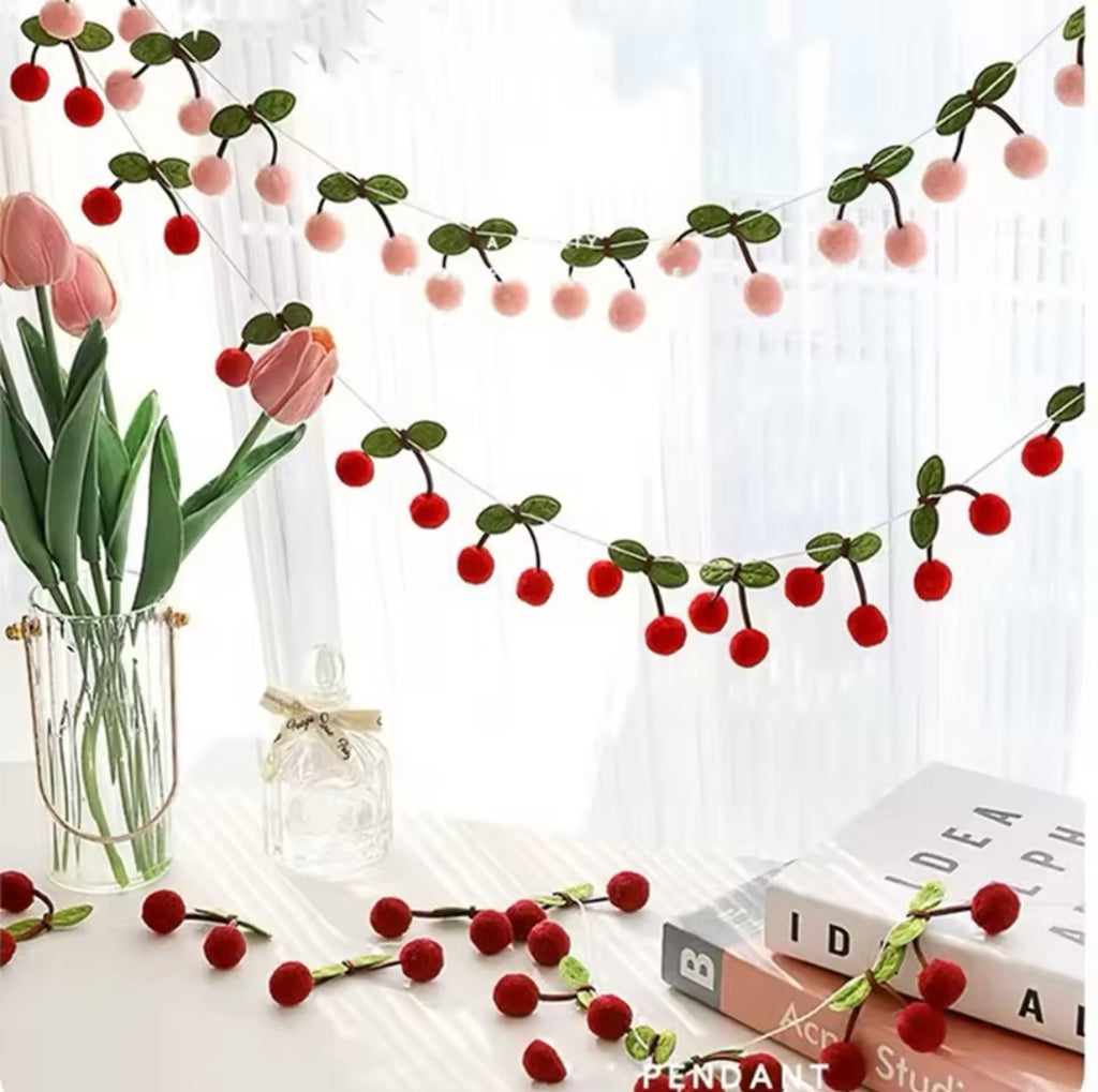 Cherry-themed banner as part of a book party setup