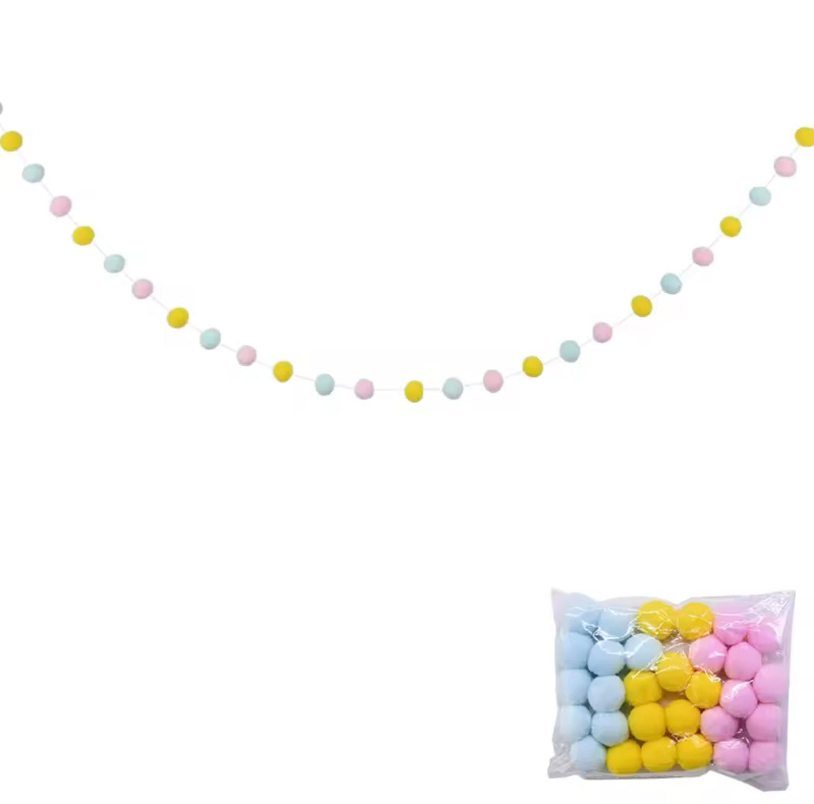 Rolled-up pompom garland showing soft texture and colors