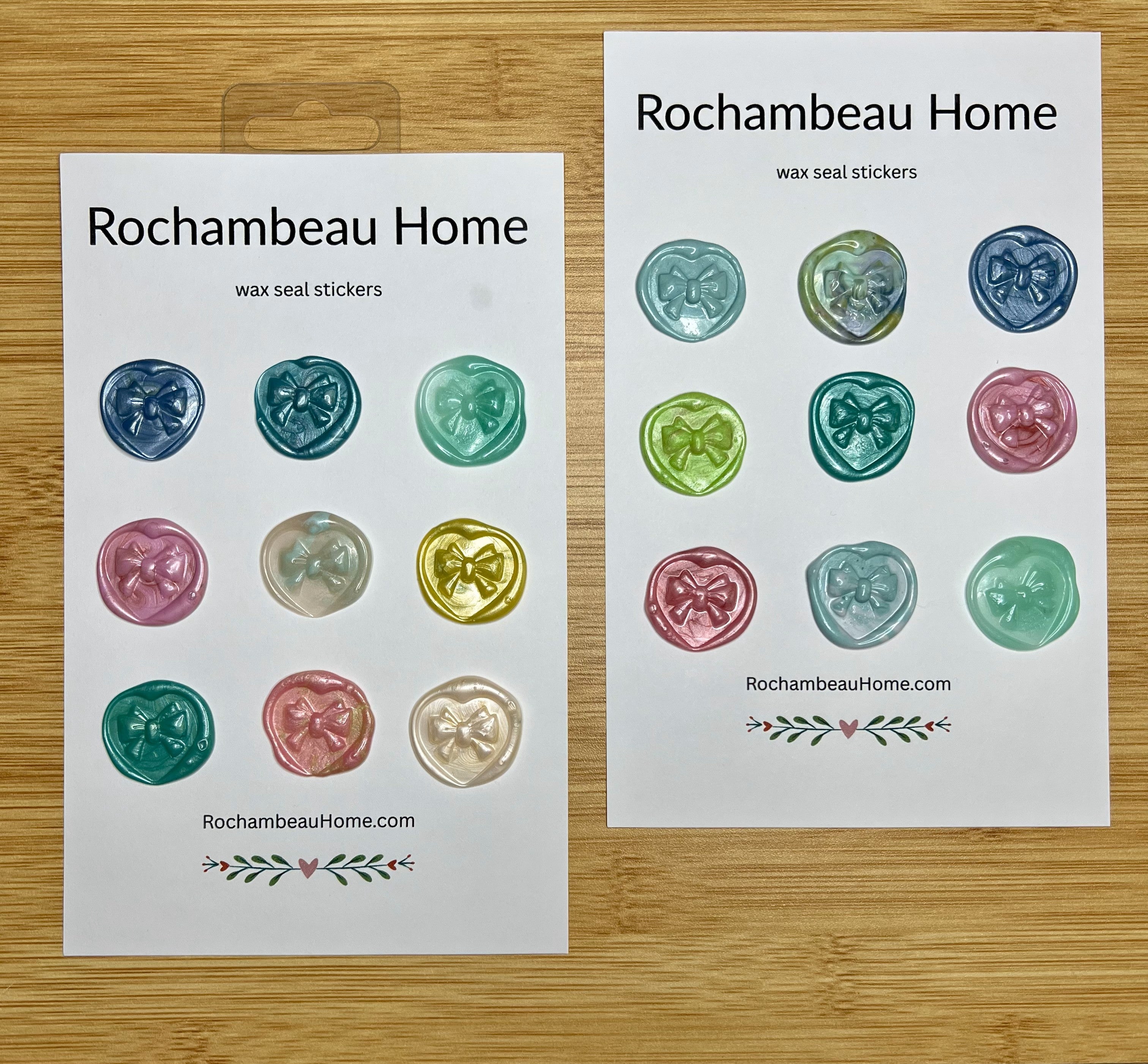 Close up view of the Heart & Bow wax seal stickers in a variety of colors