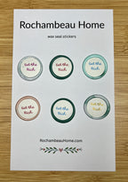 Close up view of the Eat the Rich wax seal stickers on a 6 pack card