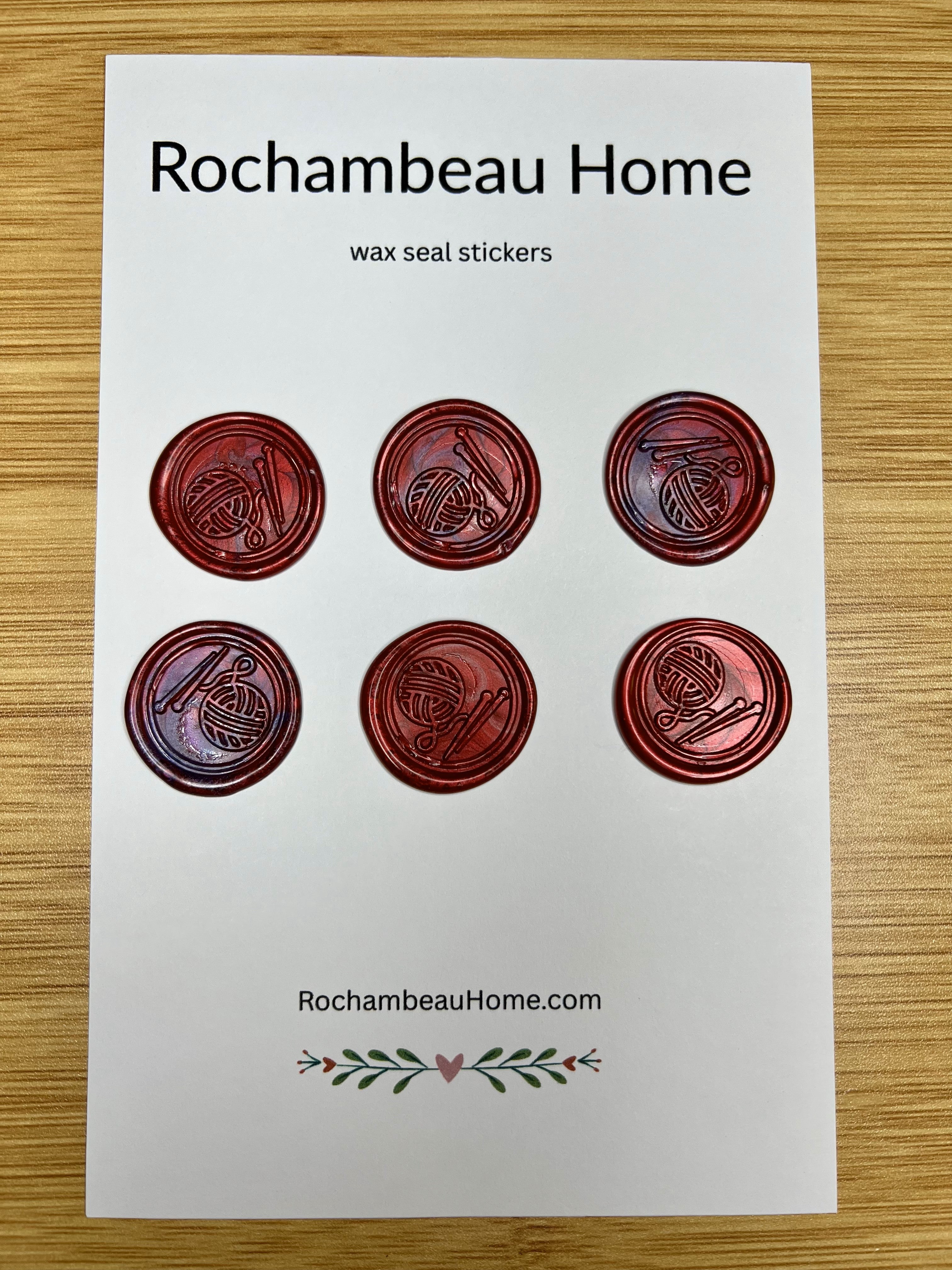 Close up view of the Handcrafted Knitting Circle wax seal stickers in red 