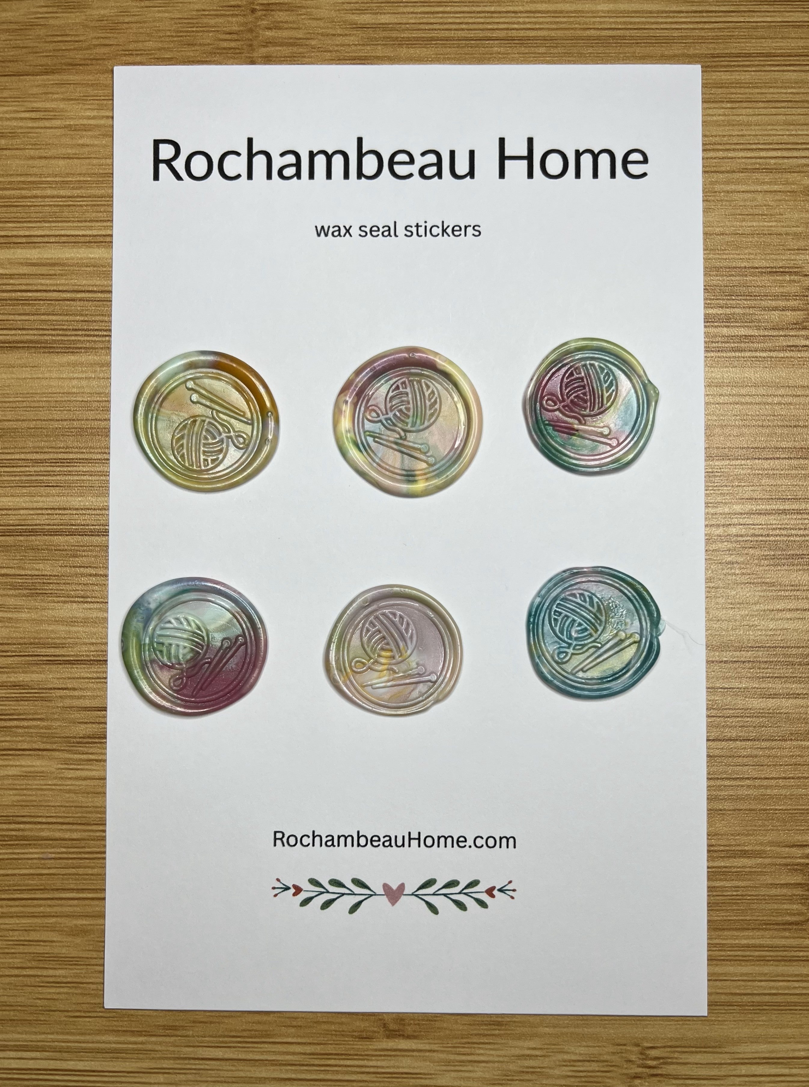 Close up view of the Handcrafted Knitting Circle wax seal stickers in a multicolor 6 pack