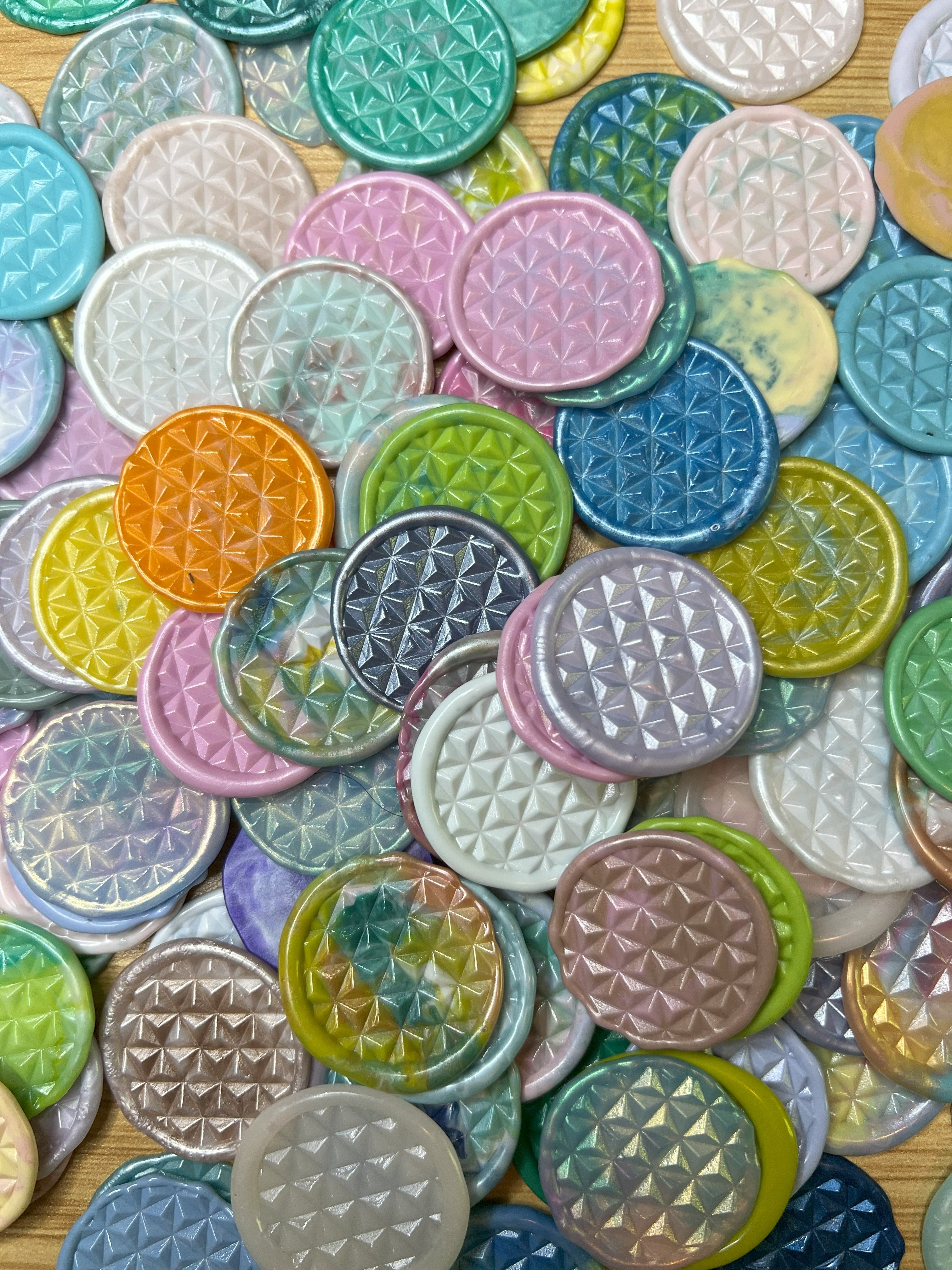 A variety of Prism Daze wax seal stickers in pile