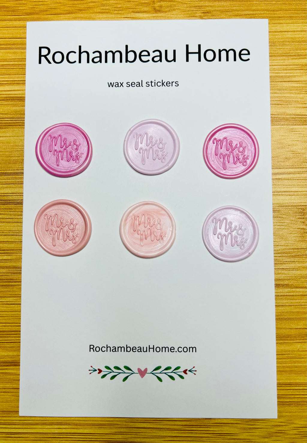 "Mr. & Mrs." wax seal stickers in a pink hue on a 6 pack card