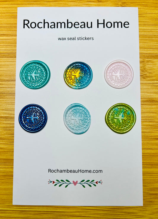 Close up view of the Air Mail wax seal stickers on a 6 pack card