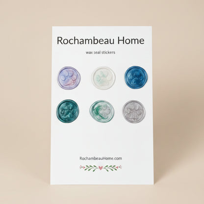 6 multicolor paw print wax seal stickers created by Rochambeau Home arranged on a display card