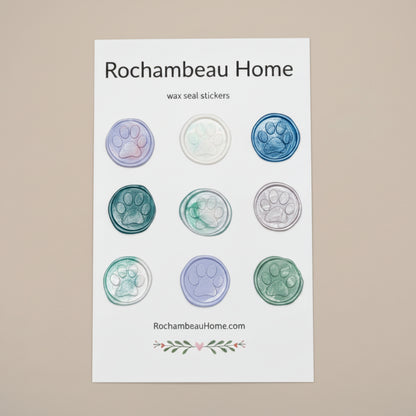 Close-up of 9 embossed paw print wax seal stickers created by Rochambeau Home Gifts
