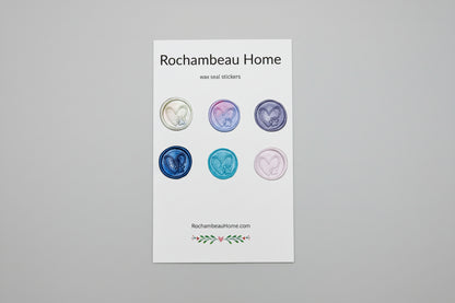 Multicolor wax seals created by Rochambeau Home featuring hand-drawn heart and pet paw design on a 6 pack display card