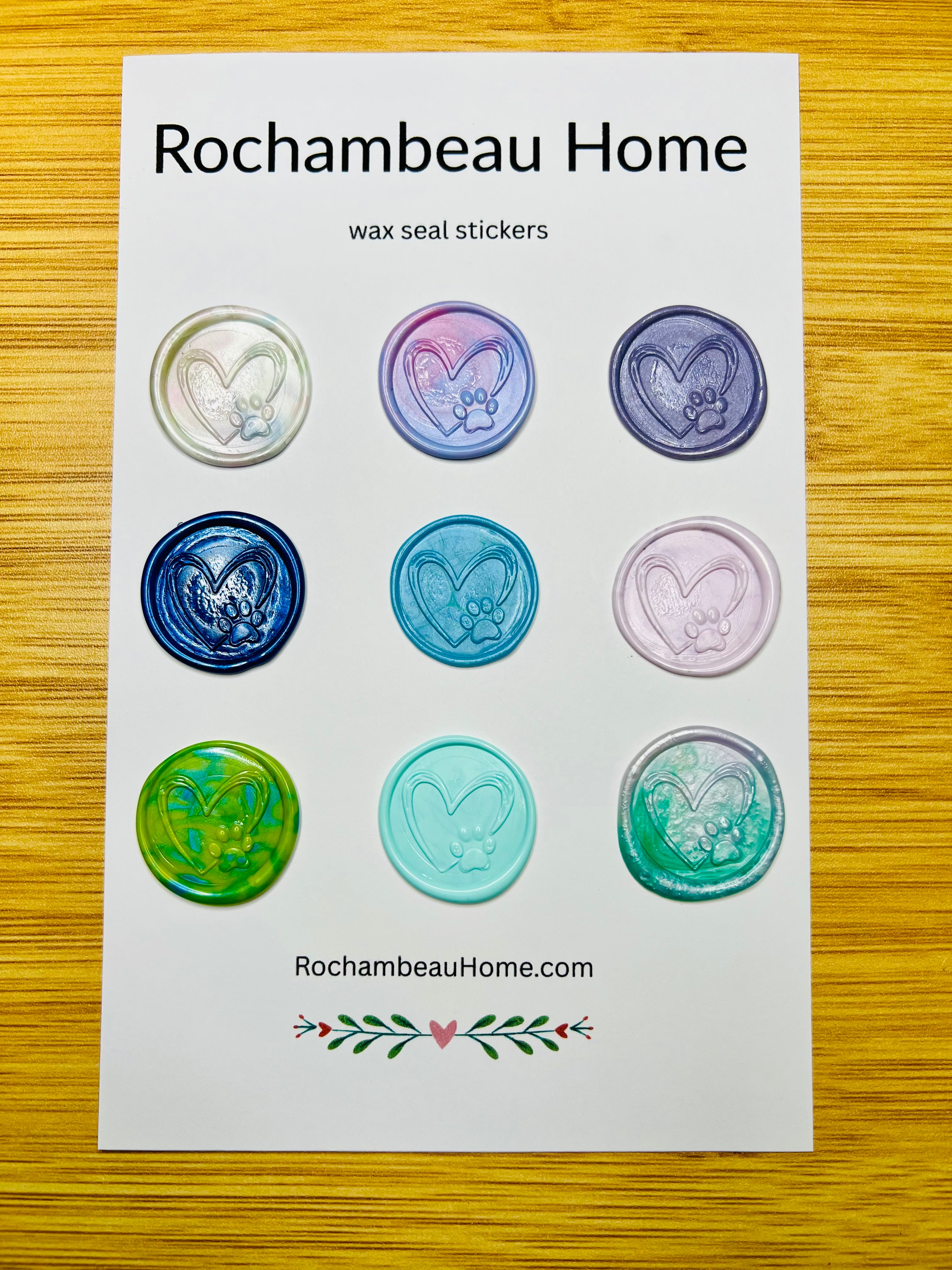 A 9 count card of paw print wax seals stickers in various colors