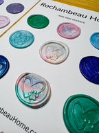 Close-up of embossed paw print inside a hand-sketched heart in artisan wax