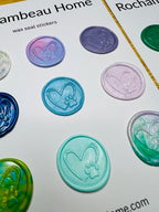 Close up view of the Paw & Heart Wax Seal Stickers in a variety of colors