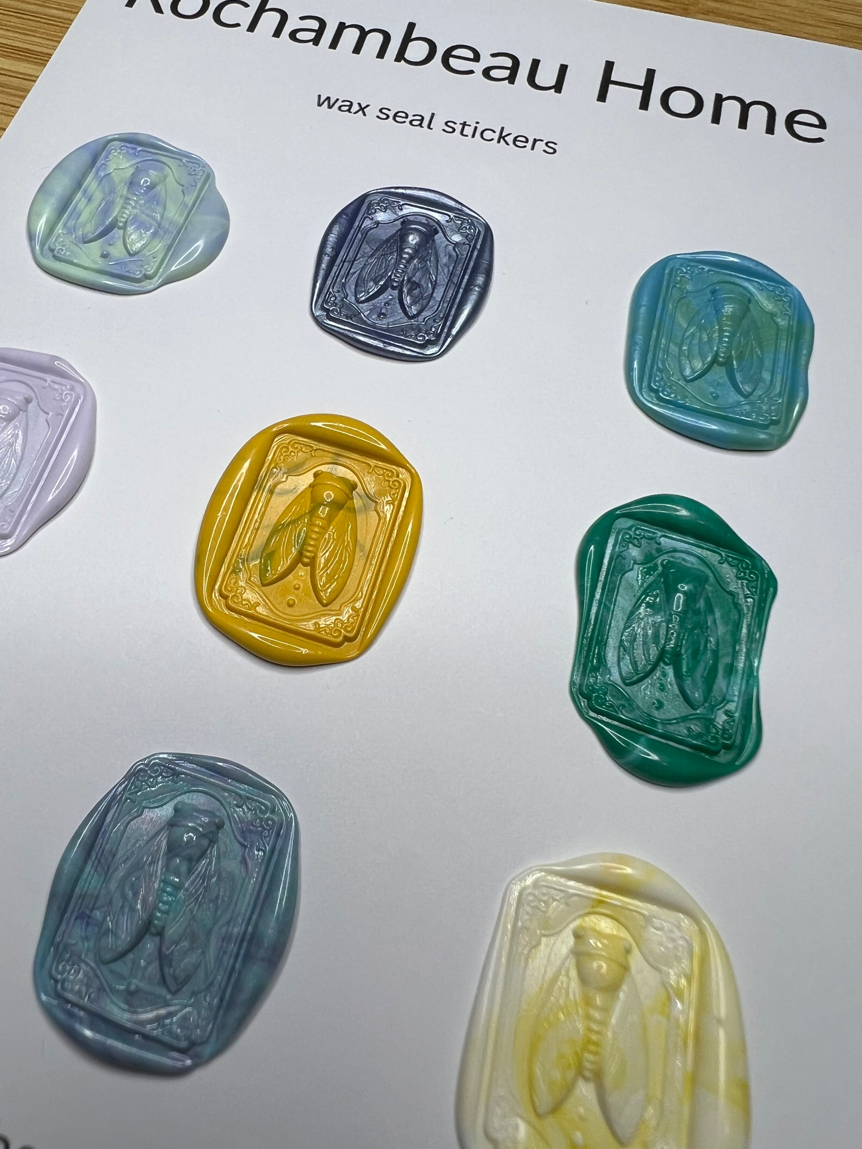 Close-up of detailed cicada beetle design surrounded by vintage flourishes