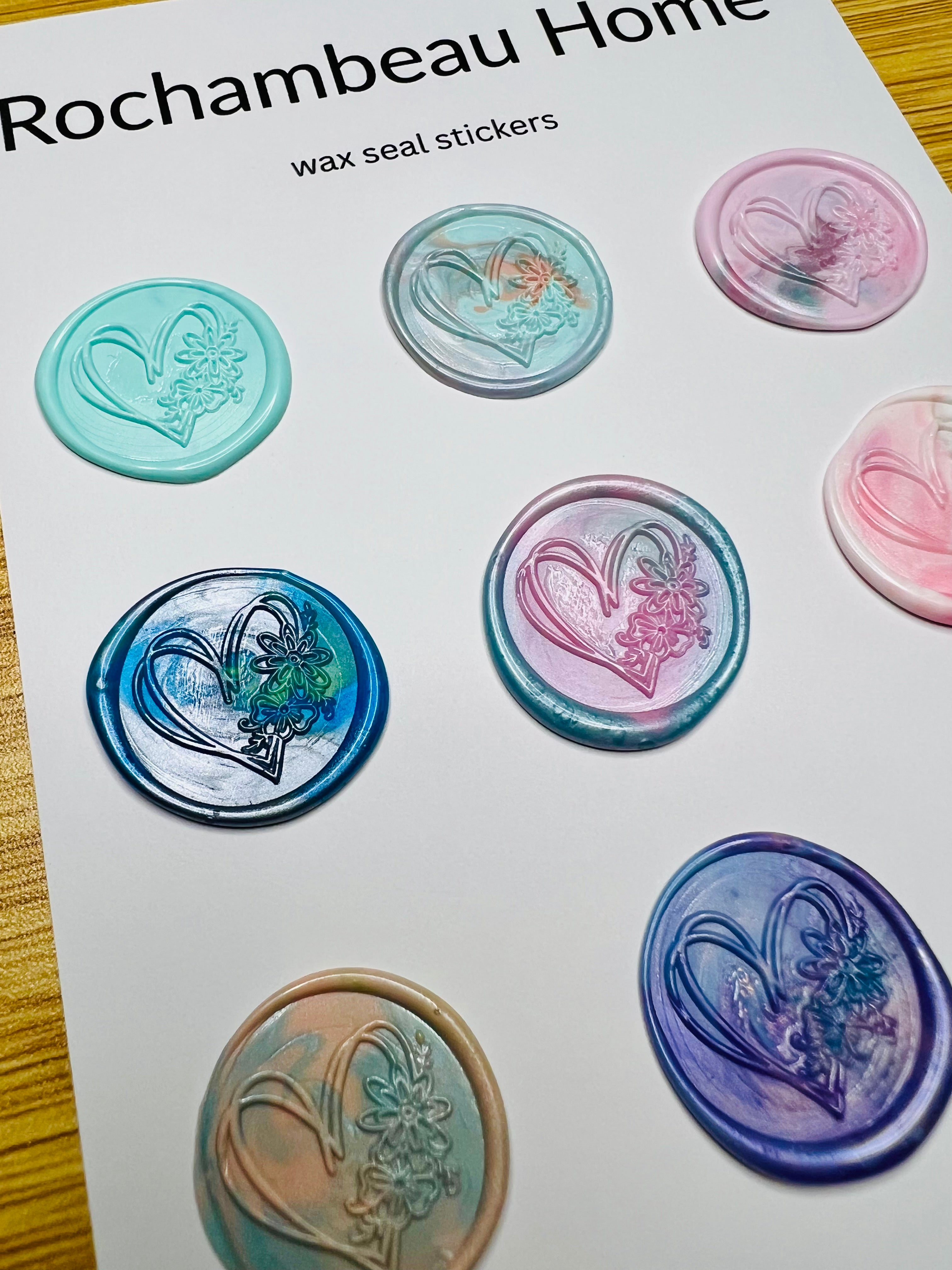 Close-up of floral-accented heart design embossed into handcrafted wax