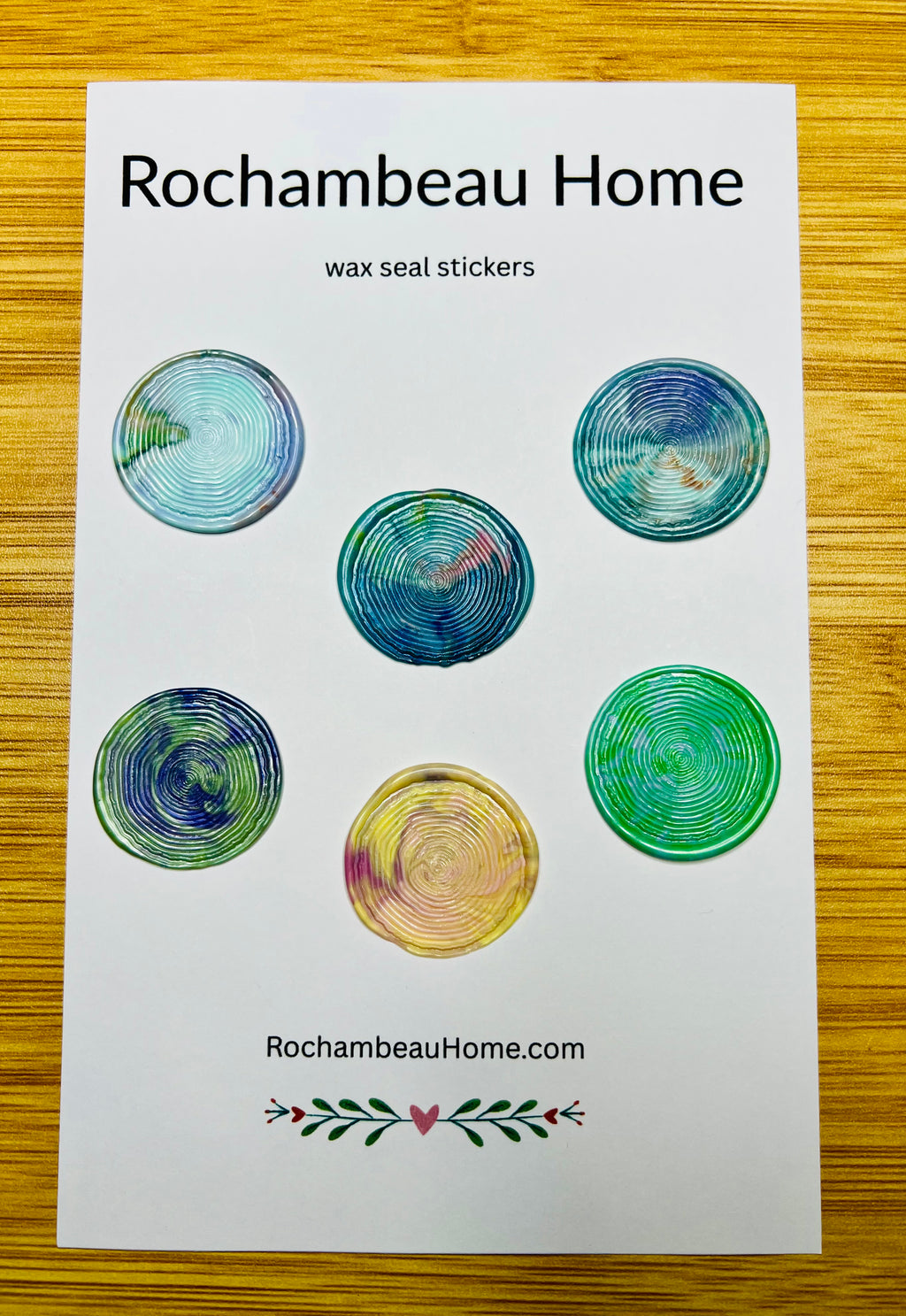 Large 2" multicolor wax seals with woodgrain tree ring embossing on a display card