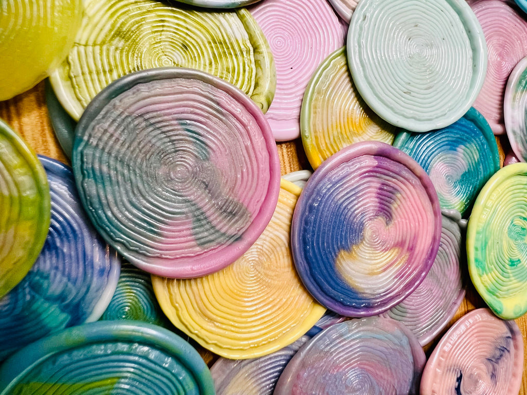 Close-up of handcrafted woodgrain texture in vivid tie-dye wax