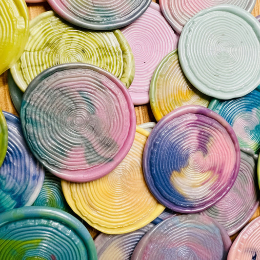 Close-up of handcrafted woodgrain texture in vivid tie-dye wax