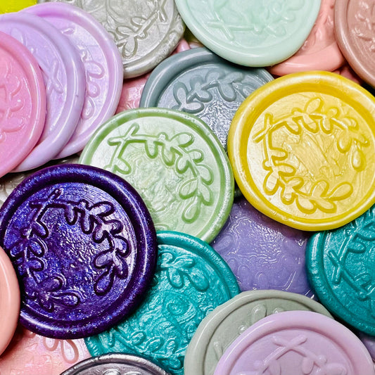 A close up view of the Olive You Always wax seal stickers in Solid Multicolor