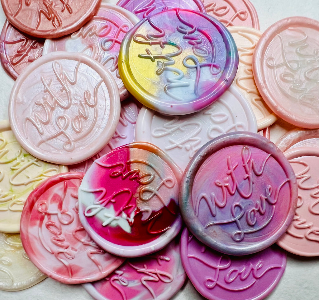 These pink-themed wax seal stickers, embossed with “With Love,” add a heartfelt touch to invitations, gifts, or snail mail. 