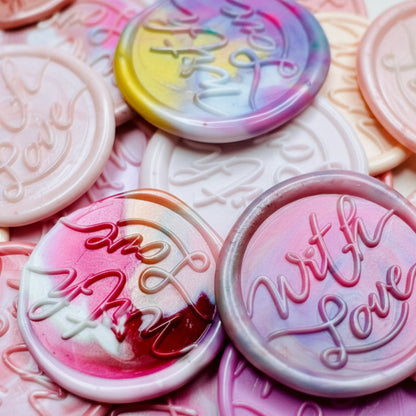 These pink-themed wax seal stickers, embossed with “With Love,” add a heartfelt touch to invitations, gifts, or snail mail. 