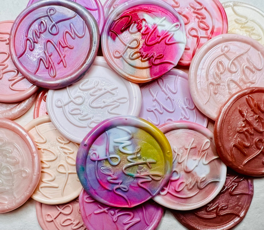 A close up view of the "With Love" wax seal stickers in the pink theme