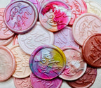 A close up view of the "With Love" wax seal stickers in the pink theme