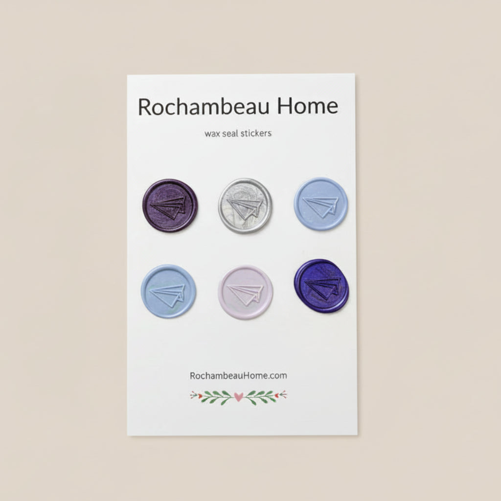 Flight of Fancy – Paper Airplane wax seal stickers created by Rochambeau Home in a purple theme