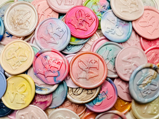 Close up view of the LOVE Letter wax seal stickers in various colors